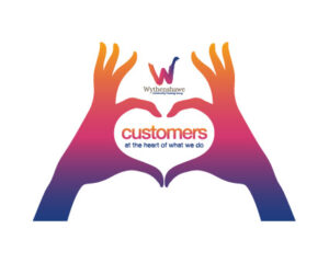 Customers At The Heart Logo